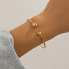 Double layered hollow knot opening bracelet for women