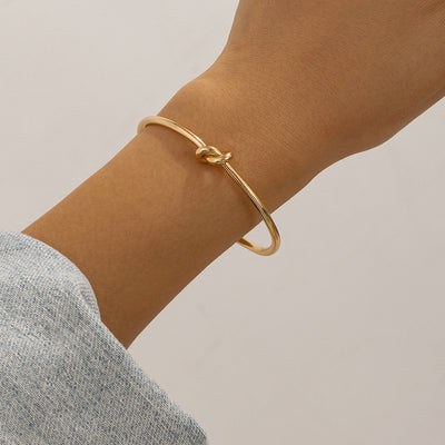 Double layered hollow knot opening bracelet for women